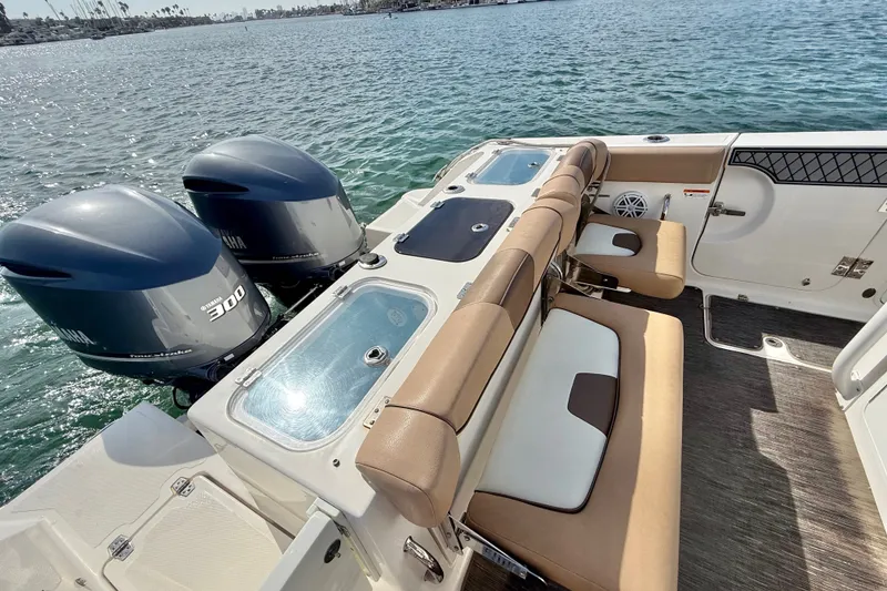 Slide: The Image of 2018 Wellcraft 302 Fisherman boat with dual Yamaha 300 engines on a sunny day. - 19