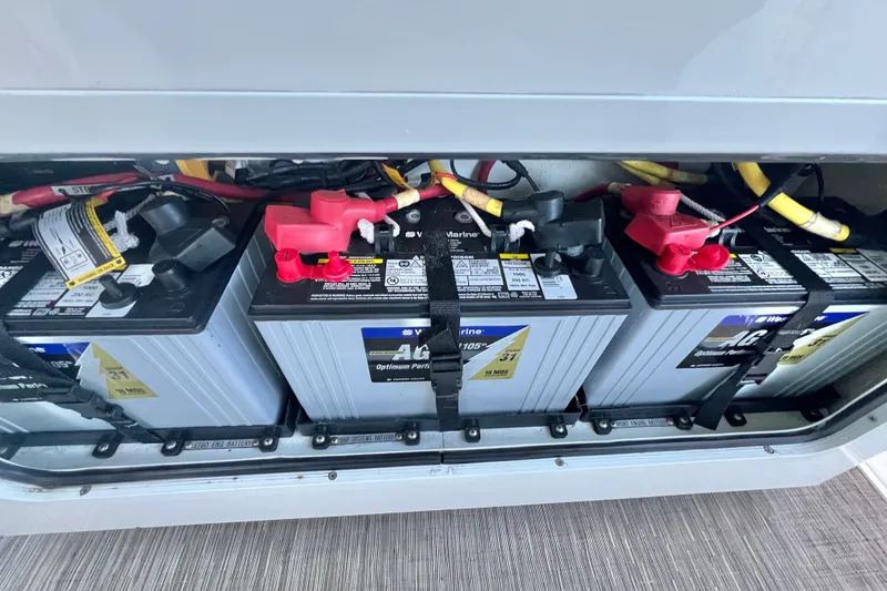 Slide: The Image of Marine batteries in a 2018 Wellcraft 302 Fisherman boat, securely installed and connected. - 29
