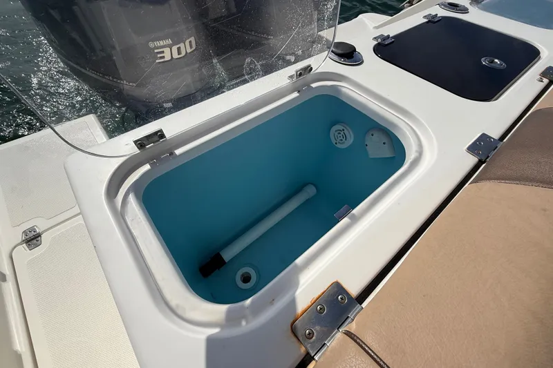 Slide: The Image of 2018 Wellcraft 302 Fisherman boat with open livewell and Yamaha 300 engine. - 20