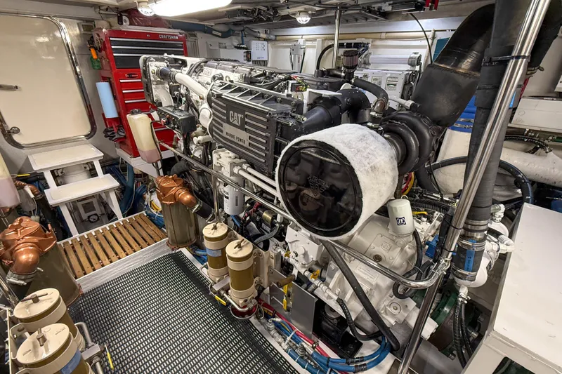 Slide: The Image of Engine room of 2003 Grand Banks 64 Aleutian RP yacht, featuring CAT marine power engine. - 77