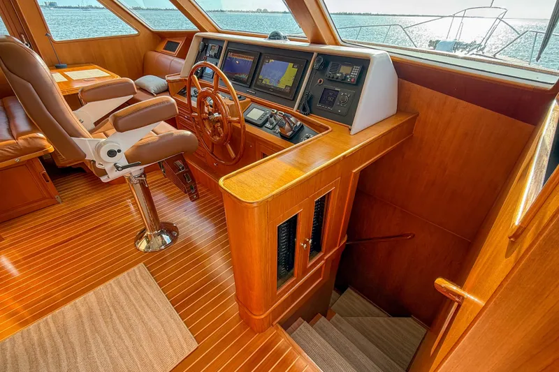 Slide: The Image of Luxurious helm of 2003 Grand Banks 64 Aleutian RP yacht with wooden interior. - 40