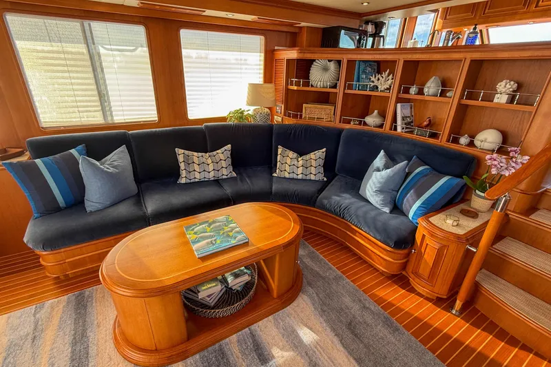 Slide: The Image of Luxurious 2003 Grand Banks 64 Aleutian RP yacht interior with elegant seating and wooden accents. - 11