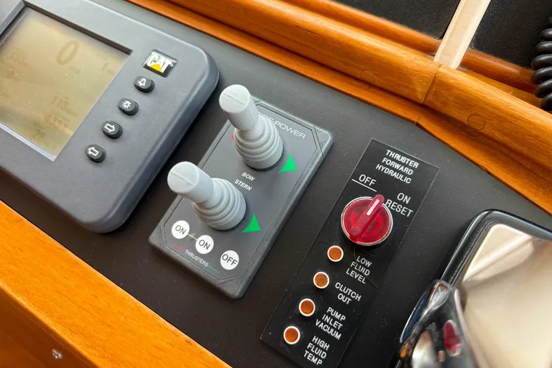Slide: The Image of Control panel of 2003 Grand Banks 64 Aleutian RP yacht with thruster controls. - 22