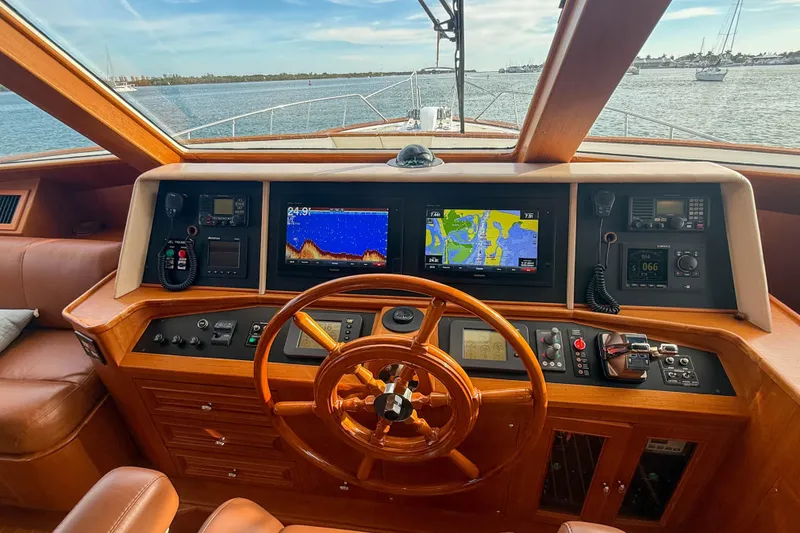 Slide: The Image of Helm of 2003 Grand Banks 64 Aleutian RP yacht with navigation screens and wooden steering wheel. - 21