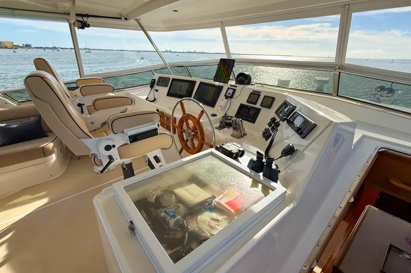Slide: The Image of Helm of 2003 Grand Banks 64 Aleutian RP yacht with navigation equipment and ocean view. - 29