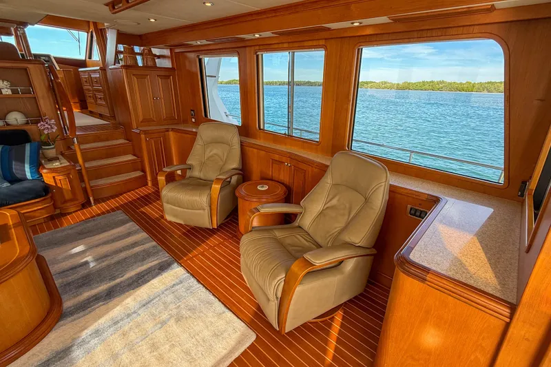 Slide: The Image of Luxurious interior of 2003 Grand Banks 64 Aleutian RP yacht with leather chairs and ocean view. - 10
