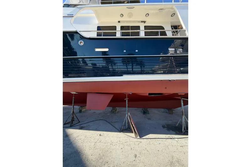 Slide: The Image of Grand Banks 64 Aleutian RP 2003 yacht on stands, showcasing hull and deck details. - 87
