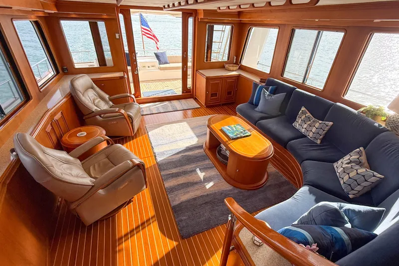 Slide: The Image of Luxurious interior of 2003 Grand Banks 64 Aleutian RP yacht with plush seating and elegant wood finishes. - 64