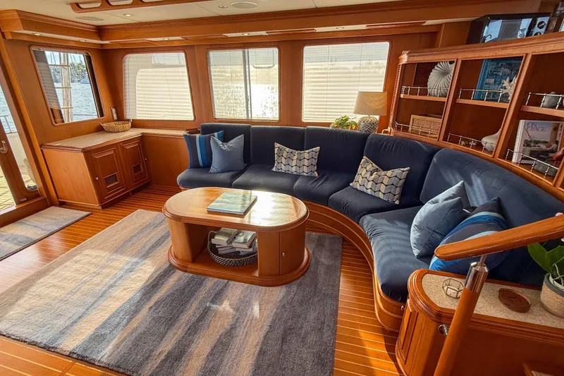 Slide: The Image of Luxurious 2003 Grand Banks 64 Aleutian RP yacht interior with elegant wood finish and plush seating. - 12