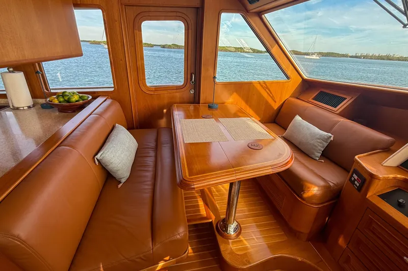 Slide: The Image of Luxurious 2003 Grand Banks 64 Aleutian RP yacht interior with leather seating and ocean view. - 23