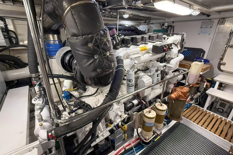 Slide: The Image of Engine room of 2003 Grand Banks 64 Aleutian RP yacht, showcasing detailed machinery. - 78