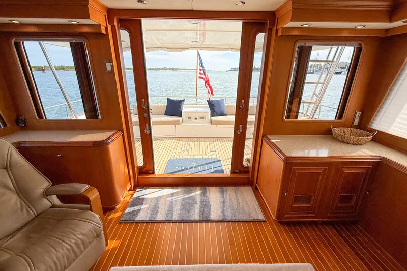 Slide: The Image of Luxurious interior of 2003 Grand Banks 64 Aleutian RP yacht with scenic ocean view. - 65