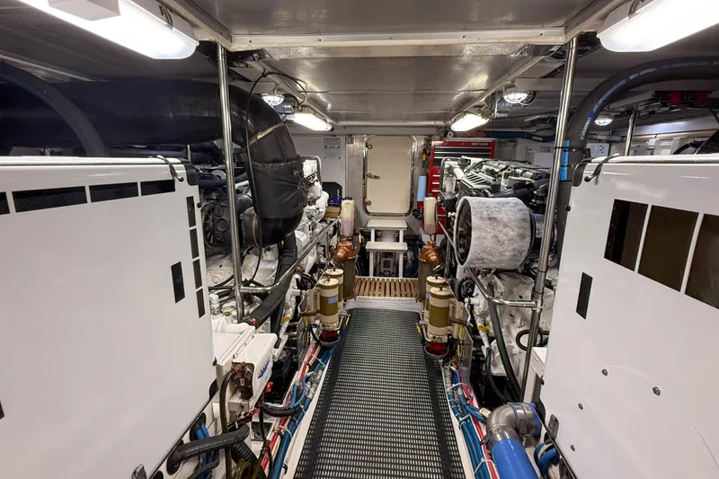 Slide: The Image of Engine room of 2003 Grand Banks 64 Aleutian RP yacht, showcasing machinery and equipment. - 76