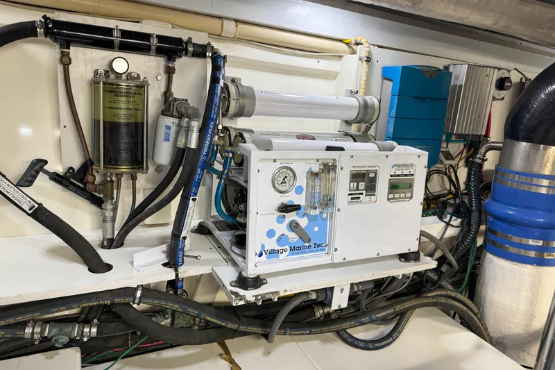 Slide: The Image of Engine room of 2003 Grand Banks 64 Aleutian RP with marine equipment and controls. - 83