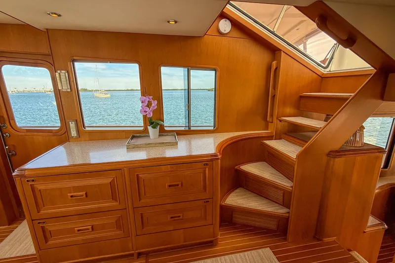 Slide: The Image of Luxurious interior of 2003 Grand Banks 64 Aleutian RP yacht with wooden cabinetry and staircase. - 26