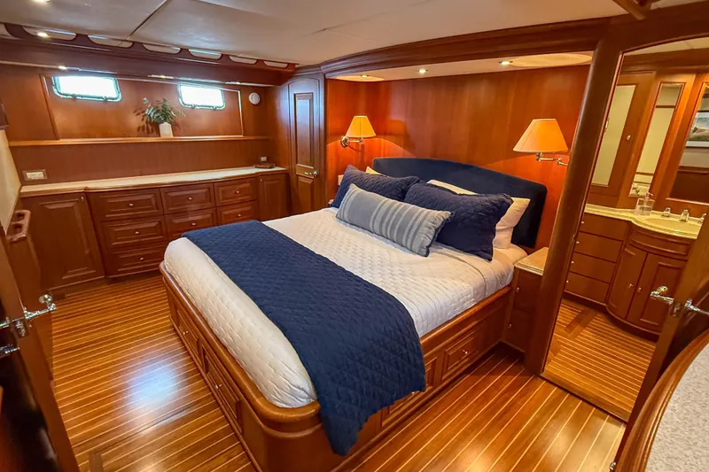 Slide: The Image of Luxurious bedroom on 2003 Grand Banks 64 Aleutian RP yacht with elegant wood finish. - 45