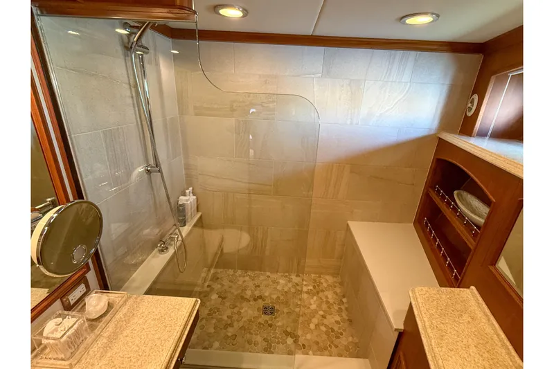 Slide: The Image of Luxurious bathroom in 2003 Grand Banks 64 Aleutian RP yacht with glass shower enclosure. - 55