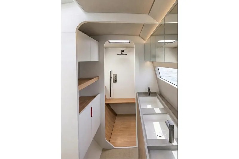 Slide: The Image of Modern NEEL 48 yacht interior with sleek bathroom design, featuring wooden accents and ample lighting. - 4