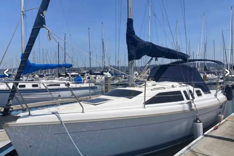 The Image of Hunter 29.5 sailboat, 1997 model, docked at marina with clear blue sky. - 0