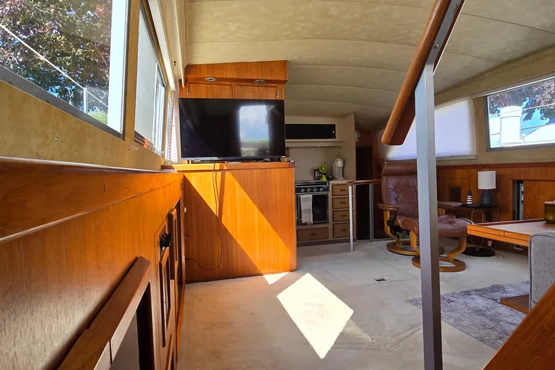 Slide: The Image of Interior of 1984 Bertram 42 Flybridge Motor Yacht with wood paneling and modern amenities. - 41