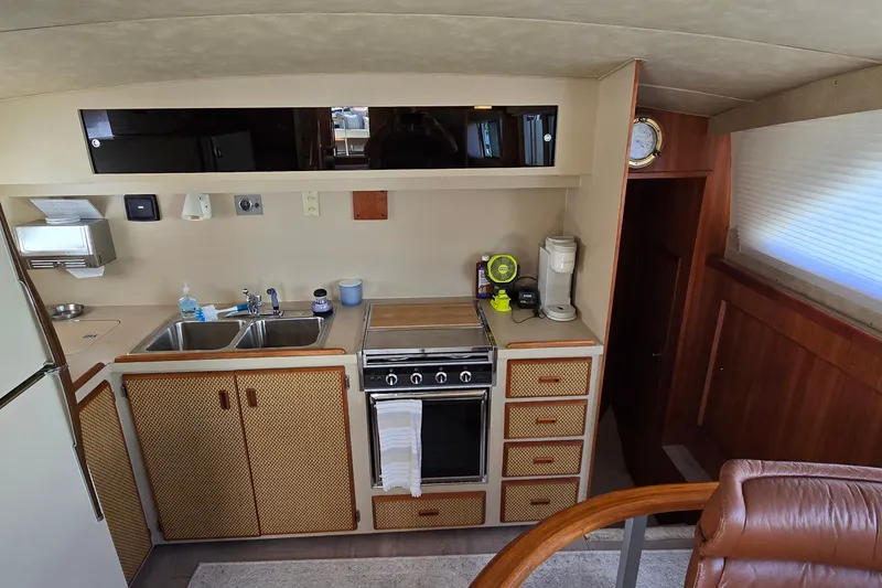 Slide: The Image of Interior of 1984 Bertram 42 Flybridge Motor Yacht kitchen with stove and sink. - 20