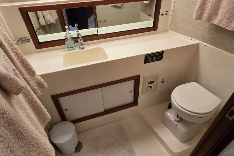 Slide: The Image of Bathroom interior of 1984 Bertram 42 Flybridge Motor Yacht with sink and toilet. - 25