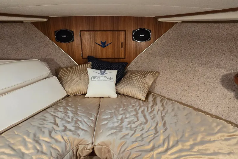 Slide: The Image of Luxurious cabin interior of 1984 Bertram 42 Flybridge Motor Yacht with elegant bedding. - 26