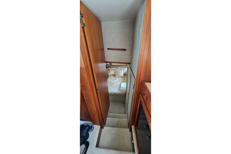 Slide: The Image of Interior view of 1984 Bertram 42 Flybridge Motor Yacht cabin with wooden finishes. - 33