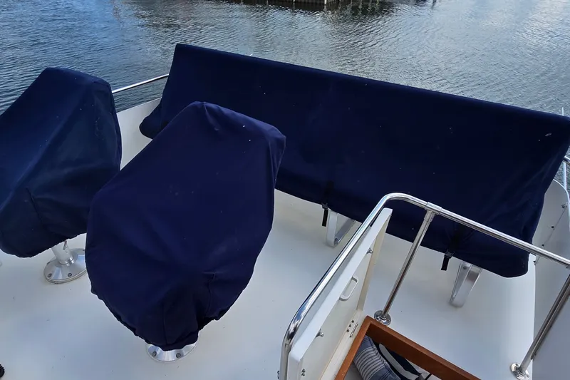 Slide: The Image of Covered seating area on a 1984 Bertram 42 Flybridge Motor Yacht. - 15