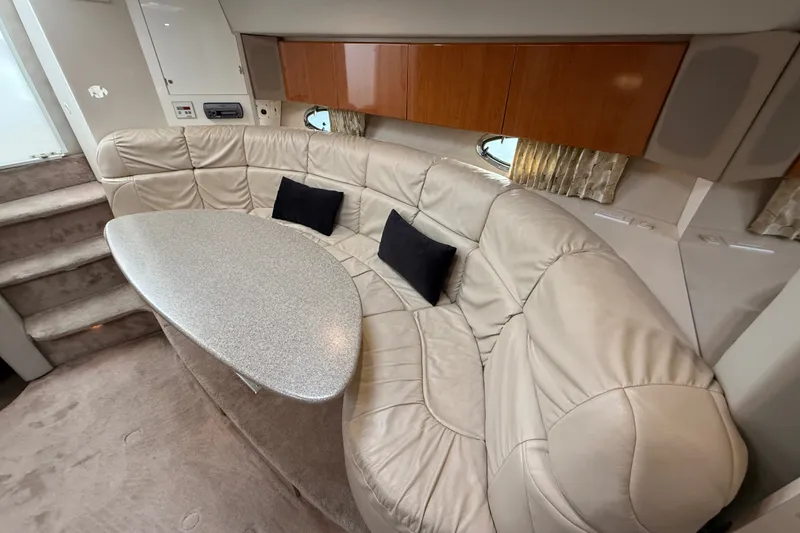 Slide: The Image of Luxurious interior of 2000 Formula 41 Performance Cruiser with plush seating and modern table. - 40