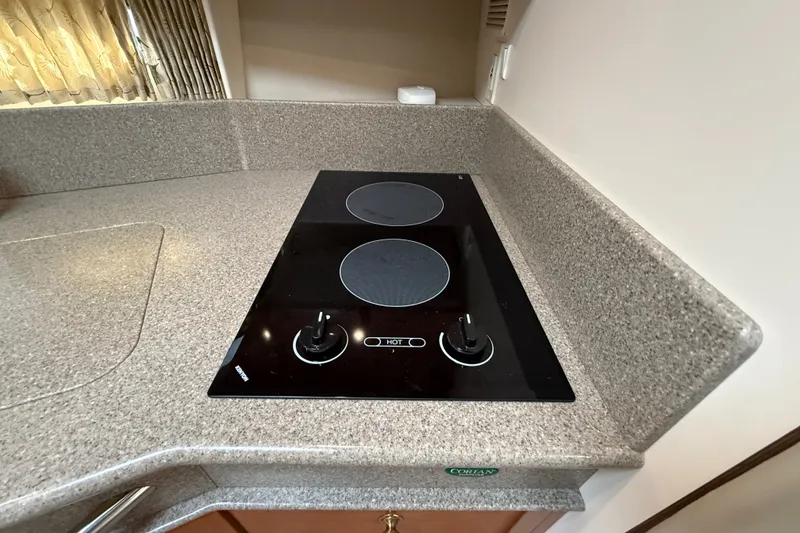 Slide: The Image of Stovetop in 2000 Formula 41 Performance Cruiser kitchen with Corian countertop. - 45