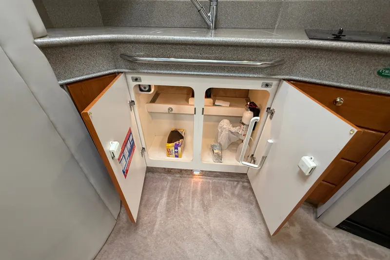 Slide: The Image of Under-sink storage in 2000 Formula 41 Performance Cruiser kitchen area. - 47