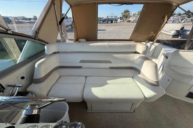 Slide: The Image of Interior of a 2000 Formula 41 Performance Cruiser with beige seating and helm. - 23