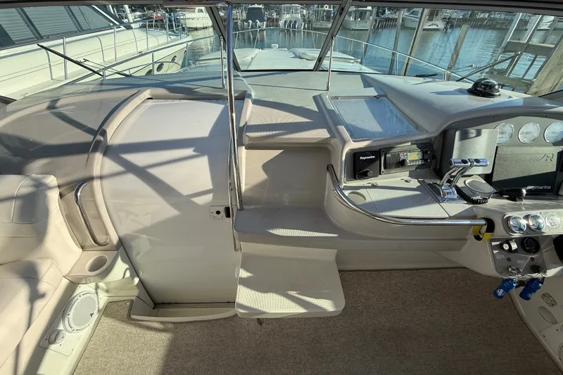 Slide: The Image of Cockpit of 2000 Formula 41 Performance Cruiser with helm controls and navigation equipment. - 20