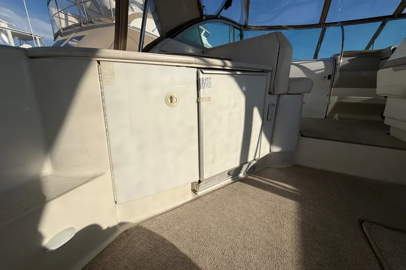Slide: The Image of Interior of a 2000 Formula 41 Performance Cruiser, featuring seating and cabinetry. - 17