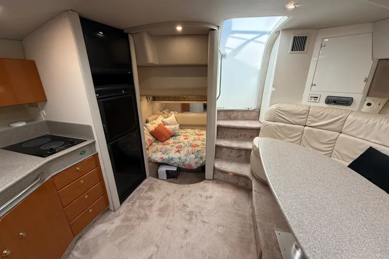 Slide: The Image of Interior of 2000 Formula 41 Performance Cruiser with cozy seating and compact kitchen. - 41