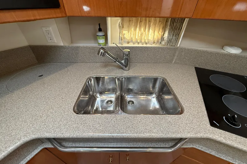 Slide: The Image of Modern kitchen sink and countertop in 2000 Formula 41 Performance Cruiser yacht. - 44