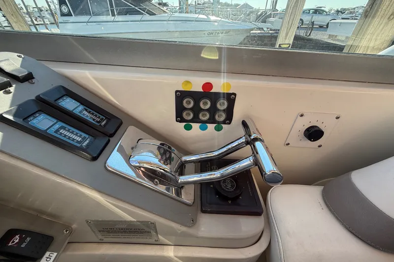 Slide: The Image of Control panel of a 2000 Formula 41 Performance Cruiser boat with throttle levers. - 32