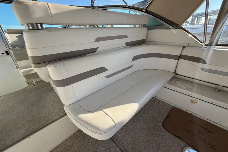 Slide: The Image of Interior seating of a 2000 Formula 41 Performance Cruiser, featuring white and gray upholstery. - 14
