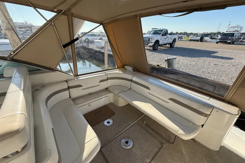 Slide: The Image of Interior of 2000 Formula 41 Performance Cruiser with beige seating and marina view. - 11