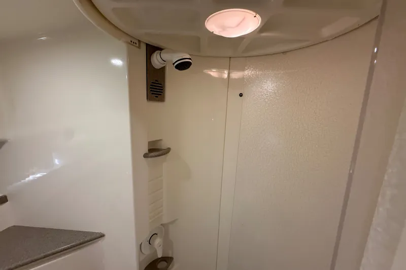 Slide: The Image of Interior shower of 2000 Formula 41 Performance Cruiser, featuring modern fixtures and lighting. - 56