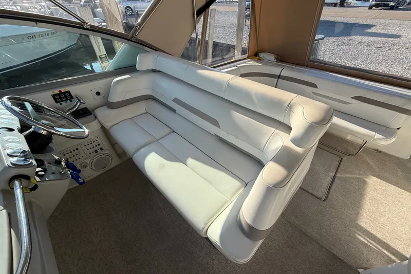 Slide: The Image of Interior of 2000 Formula 41 Performance Cruiser with beige seating and helm controls. - 22