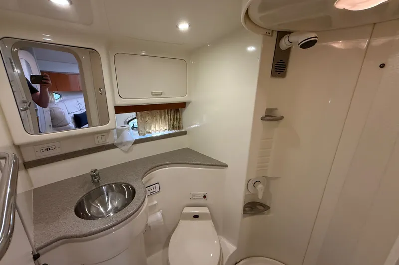 Slide: The Image of Bathroom interior of 2000 Formula 41 Performance Cruiser with sink, toilet, and shower. - 53
