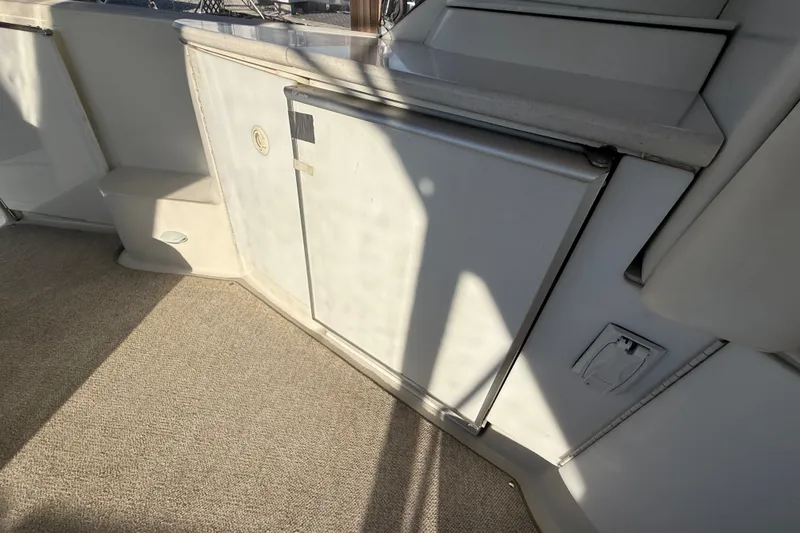 Slide: The Image of Interior view of a 2000 Formula 41 Performance Cruiser, featuring a compact kitchenette area. - 16