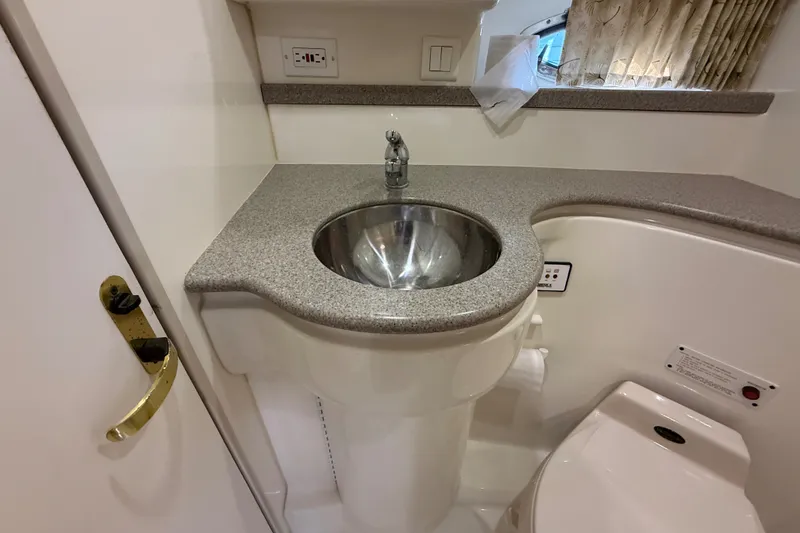 Slide: The Image of Bathroom sink and countertop in a 2000 Formula 41 Performance Cruiser yacht. - 54