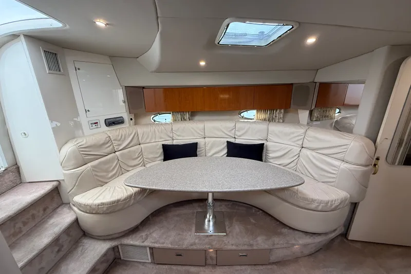 Slide: The Image of Interior of 2000 Formula 41 Performance Cruiser with plush seating and modern table. - 38
