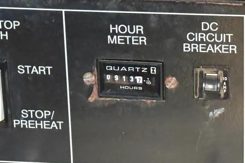 Slide: The Image of Hour meter and circuit breaker panel on 2000 Formula 41 Performance Cruiser. - 64