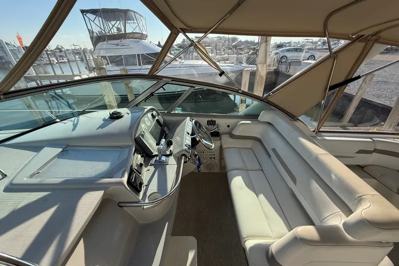 Slide: The Image of Interior of a 2000 Formula 41 Performance Cruiser with helm and seating area. - 21