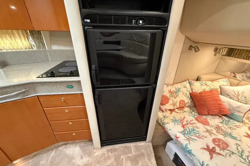 Slide: The Image of Interior of 2000 Formula 41 Performance Cruiser with kitchen and cozy sleeping area. - 43