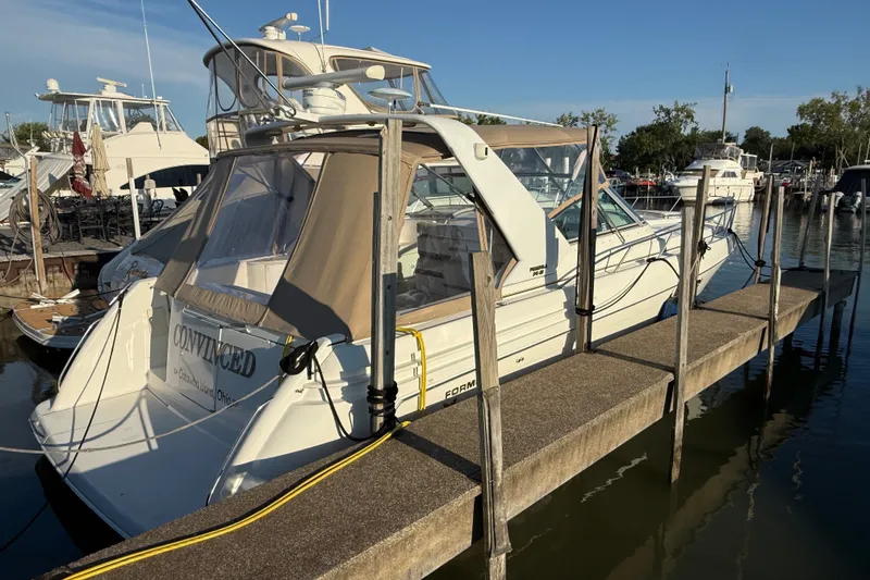Slide: The Image of 2000 Formula 41 Performance Cruiser docked at marina, sunny day. - 3